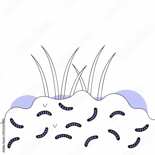 Worm castings with earthworms and green grass in garden soil concept  