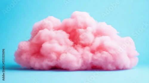 A large, fluffy pink cloud sits on a blue background. The cloud is so big that it takes up most of the , and its pink color is vibrant and eye-catching