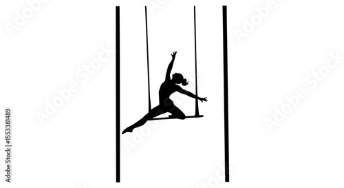Athletic silhouette of a woman performing a dynamic trapeze routine showcasing strength flexibility and grace in a circus performance