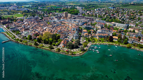 Fototapeta Naklejka Na Ścianę i Meble -  A panoramic aerial view around the old town of the city Morges in Switzerland on a sunny spring noon