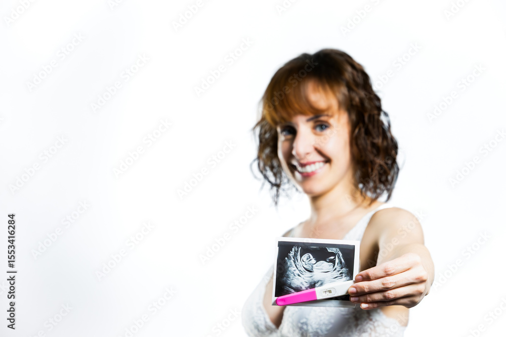 Woman showing positive pregnancy test and ultrasound with joyful expression. Lifestyle. Woman showing positive pregnancy test and ultrasound with joyful expression. Lifestyle.