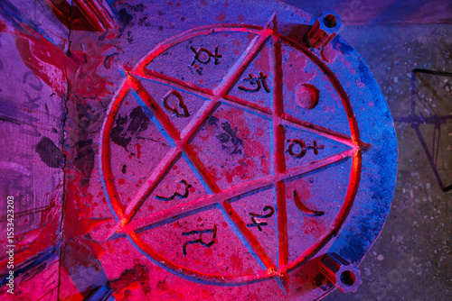 Canvas Print A pentagram with fire in a dark room. Quest