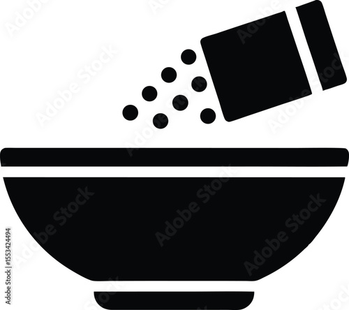 Bowl receives granular contents being dispensed from a rectangular container in this transparent image