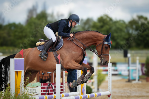 Close-ups of a show jumping horse and rider during a show jumping competition.