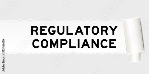 Ripped gray paper background that have word regulatory compliance under torn part