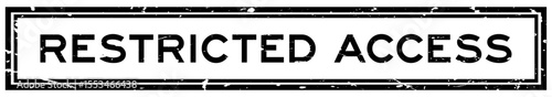Grunge black restricted access word square rubber seal stamp on white bacckground