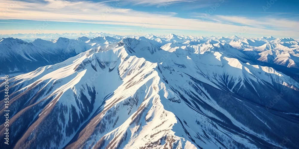 Fototapeta premium Majestic snow-capped peaks, pristine winter landscape from above, summit, wilderness