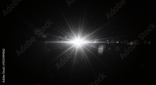 Horizontal bright star flare with glow rays and light spots on black