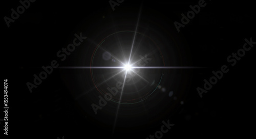 Bright white star flare with glow rays on black background