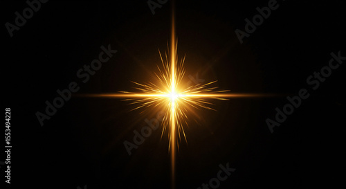 Glowing golden cross star flare on dark background