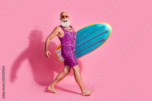 Photography Photo of cheerful optimistic pensioner wear swimsuit summer vacation resort surf