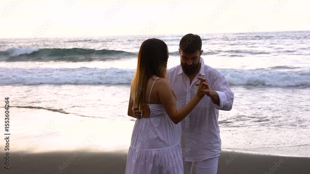 Happy couple having tender moment and dancing together on the beach during summer vacation - Pregnancy, relationship bonding and family concept Happy couple having tender moment and dancing together on the beach during summer vacation - Pregnancy, relationship bonding and family concept