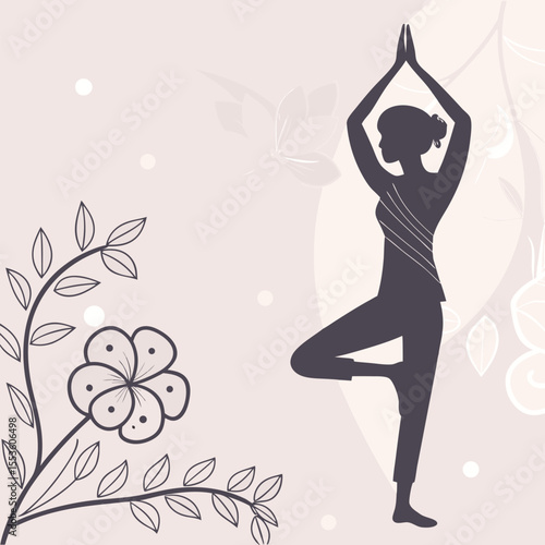Silhouette of a woman in tree pose with hands together, adorned with a floral branch on the left side