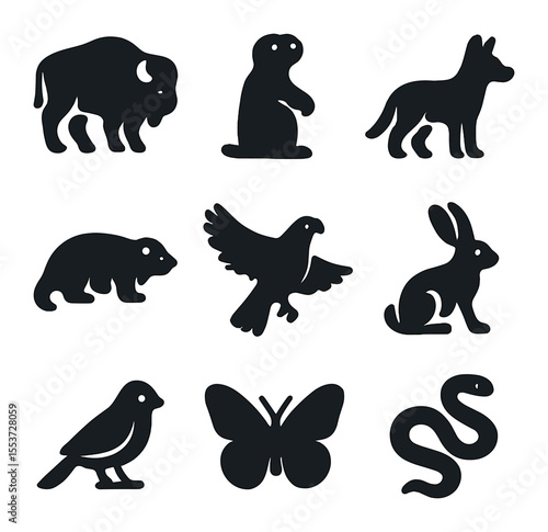 Prairie Wildlife Icons. Solid, filled icons set of prairie wildlife: bison, prairie dog, coyote, badger, hawk,