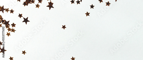 Banner with golden stars confetti scattered on a blue background.