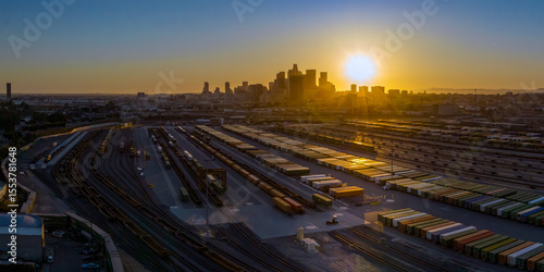 Photography Sunset light rays reflecting off shipping containers in rail yard outside of dow