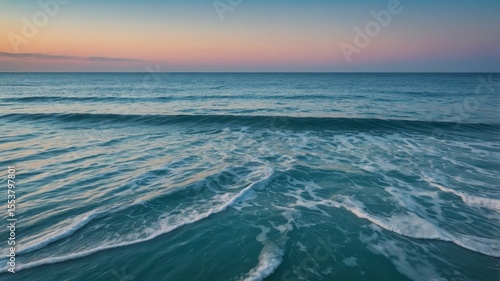 Beautiful Ocean Waves Softly Crashing Against the Shore During Sunset in a Tranquil Coastal Setting