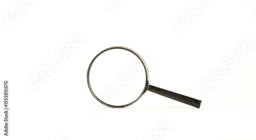 Black magnifying glass. Audit, data analysis, information learning, preparation for exams concept. White background. High quality photo. Evoking detective theme with space for additional text.