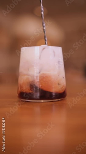 Mixing a coffee drink with ice