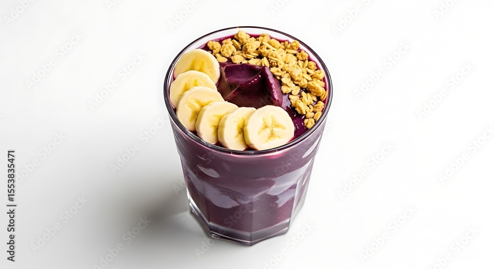 Acai bowl with banana slices and granola. Acai bowl with banana slices and granola.