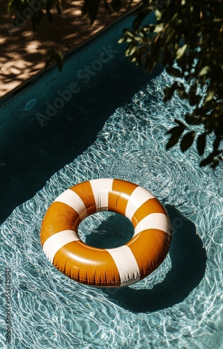 Bright Inflatable Ring Floating in a Sparkling Swimming Pool on a Sunny Day.