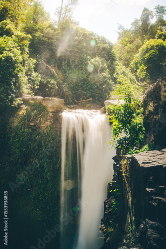 Golden Mist Over Jungle Waterfall at Sunrise