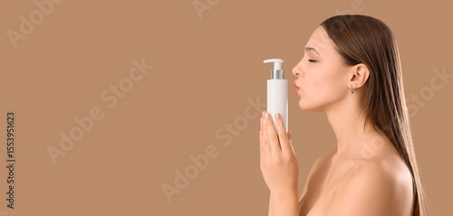 Young woman with bottle of ...
