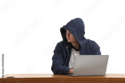Hacker using laptop at tabl...