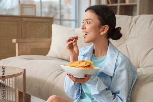 Young girl eating tasty chi...