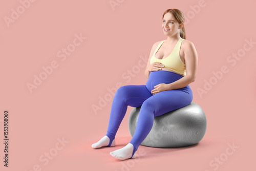 Sporty young pregnant woman...