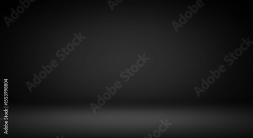 Subtle luminosity in a muted black and charcoal grey gradient backdrop with a soft ground plane