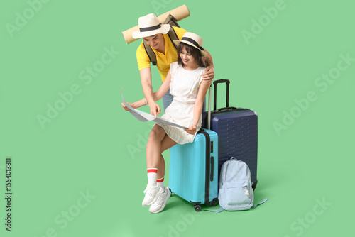 Couple of tourists with map...