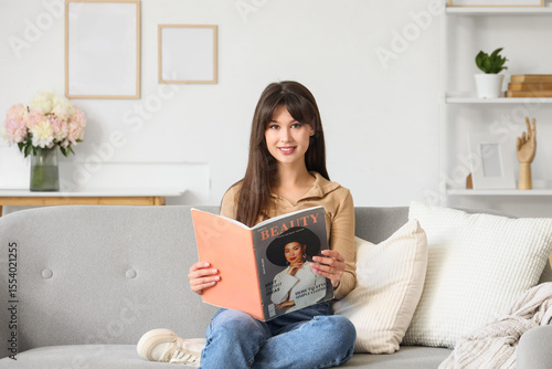 Young woman reading beauty ...