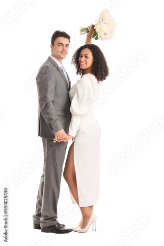 Young wedding couple on whi...