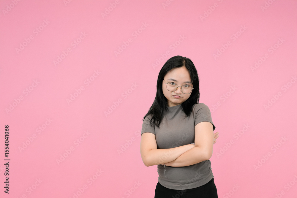 young asian woman showing dissapointed in studio background young asian woman showing dissapointed in studio background
