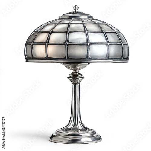 Elegant silver table lamp with a glass shade, illuminated in a cozy room setting