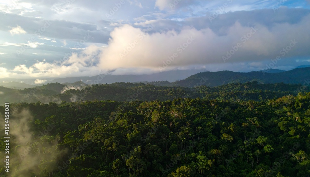 Time-lapse clouds drift over a serene mountain landscape with a misty forest and green valleys at sunrise Time-lapse clouds drift over a serene mountain landscape with a misty forest and green valleys at sunrise