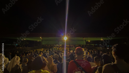 Foto group of people at night low light photo Jogja June 27, 2025 Friday evening even