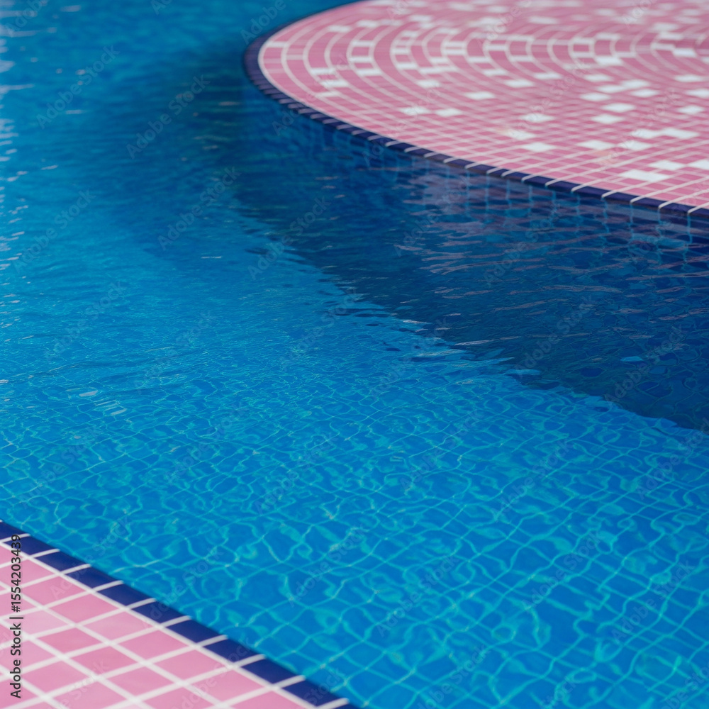 Obraz premium swimming pool in the hotel. blue swimming pool. Blue pool water texture with pink tiles.