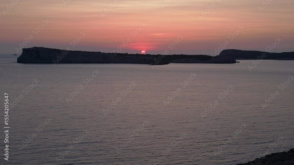 Yoga Hippie Girl at sunset with island in the background, Ibiza, Spain. Wonderful aerial view flight descending drone Yoga Hippie Girl at sunset with island in the background, Ibiza, Spain. Wonderful aerial view flight descending drone