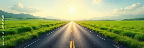 Endless asphalt ribbon disappearing into a hazy horizon, flanked by lush green fields under a vast, clear sky Perfect for travel, nature, and freedom themes , rural, summer