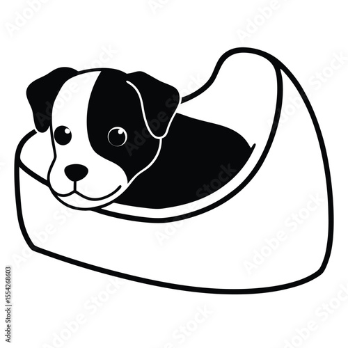 Cute black and white dog resting comfortably in a soft bed