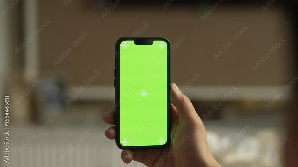 POV Close-Up of Hands Holding a Smartphone with Green Screen – Chroma Key Mockup for App and Media Content