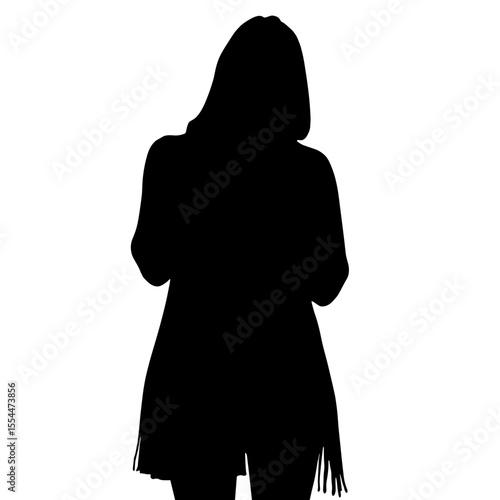 Silhouette of person in long knit tunic tying scarf, seasonal style