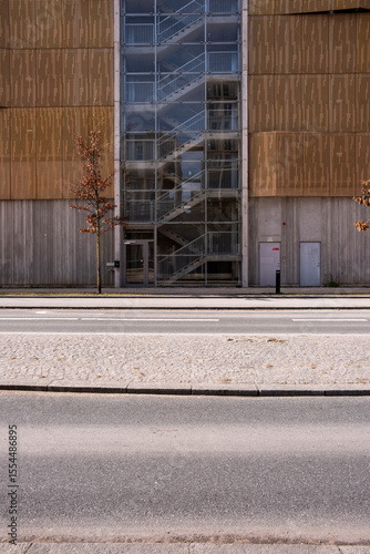Wallpaper Mural Contemporary architecture in Copenhagen featuring vertical wooden slats, modern facade design and soft urban daylight, highlighting geometric rhythm and minimalist aesthetic. Torontodigital.ca