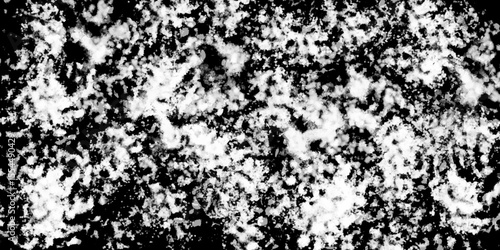 Snowflakes on dark background. white icy snowflakes isolated on black background, natural background. white crystalline powder on a black background. sugar dust. texture, pattern and clipping.