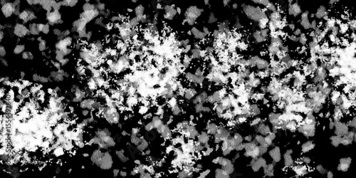 Snowflakes on dark background. white icy snowflakes isolated on black background, natural background. white crystalline powder on a black background. sugar dust. texture, pattern and clipping.