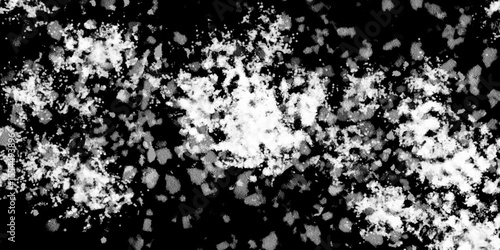 Snowflakes on dark background. white icy snowflakes isolated on black background, natural background. white crystalline powder on a black background. sugar dust. texture, pattern and clipping.