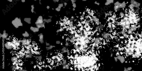 Snowflakes on dark background. white icy snowflakes isolated on black background, natural background. white crystalline powder on a black background. sugar dust. texture, pattern and clipping.