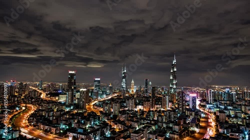 Wallpaper Mural Expansive futuristic city glowing at night under dark clouds with vibrant lights and illuminated highways, symbolizing progress, hyper-urbanization, surveillance culture, connectivity Torontodigital.ca